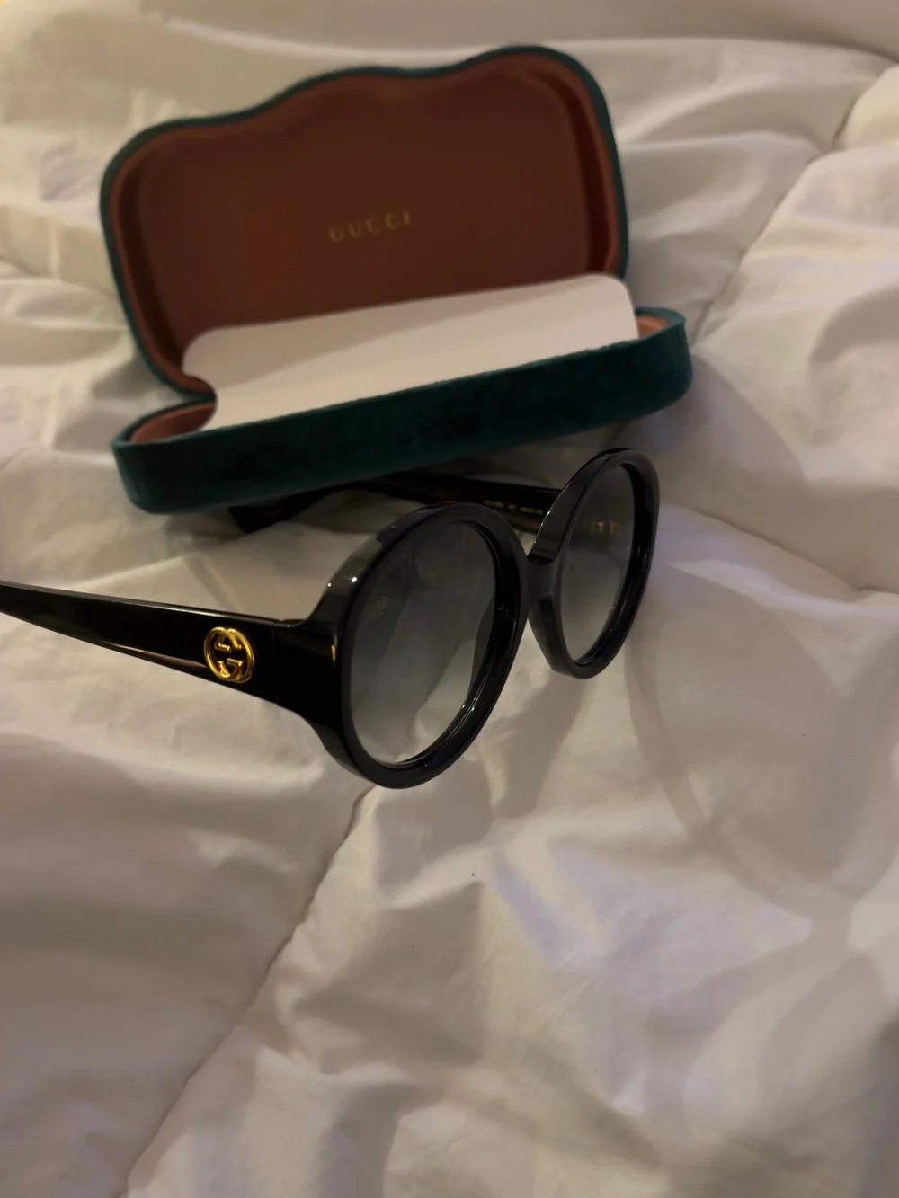 Gucci Black Round Sunglasses with Gold Logo Accent